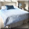 F19. King bed with upholstered headboard. 